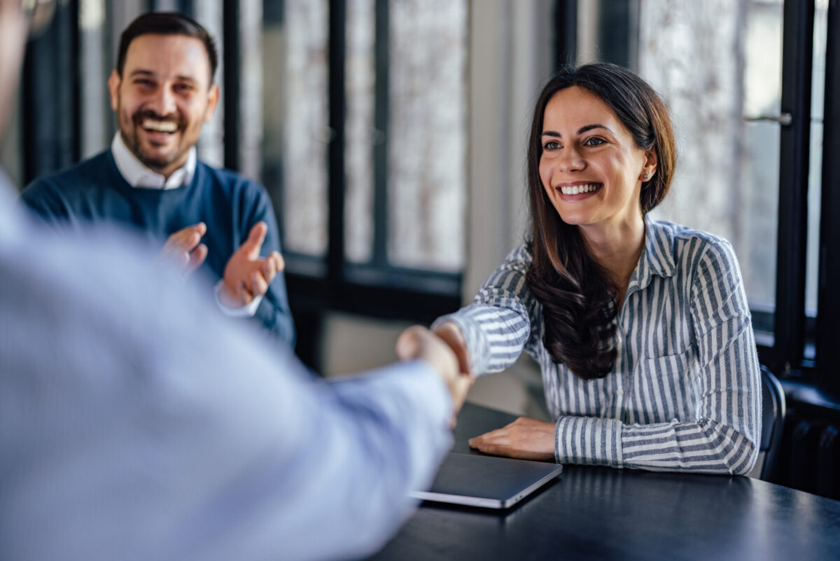 tenant shaking hands with new property owner